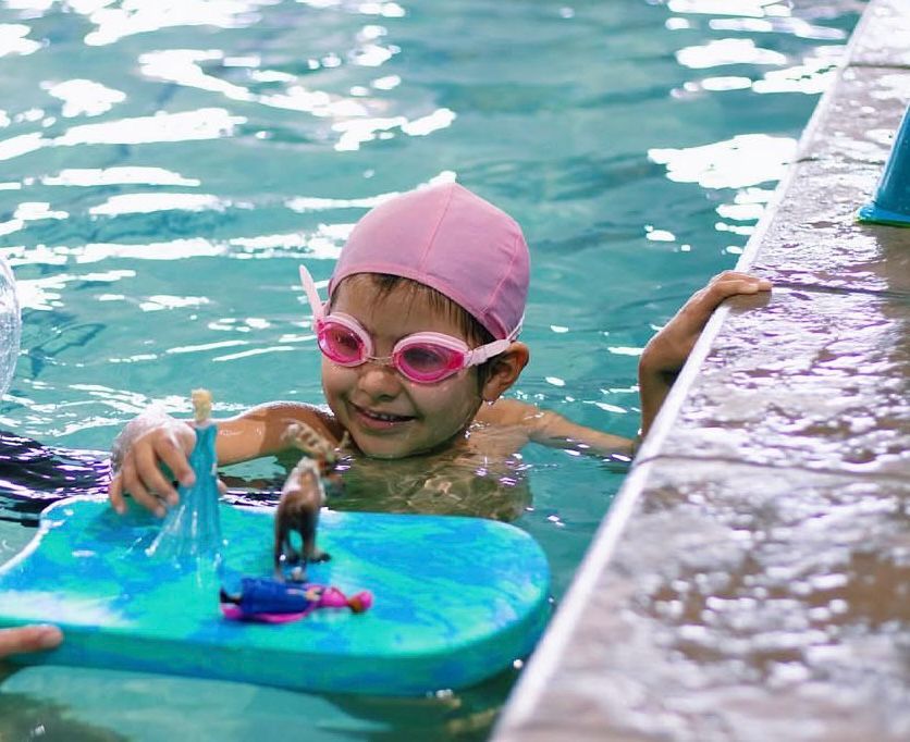 Swimmers in a pool at Outswimmer Swim School